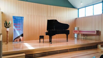 Stage of Mansfield Room with Yamaha Grand Piano and Harpsichord