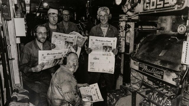 1996 Canberra Times printing press with workers holding copies of the newspaper