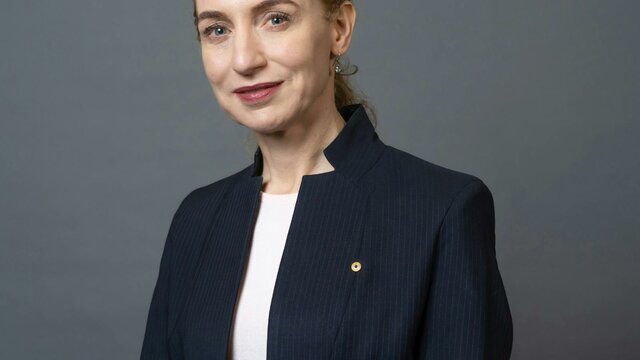 Professor Georgina Long AO Headshot of a woman wearing a white shirt and blazer