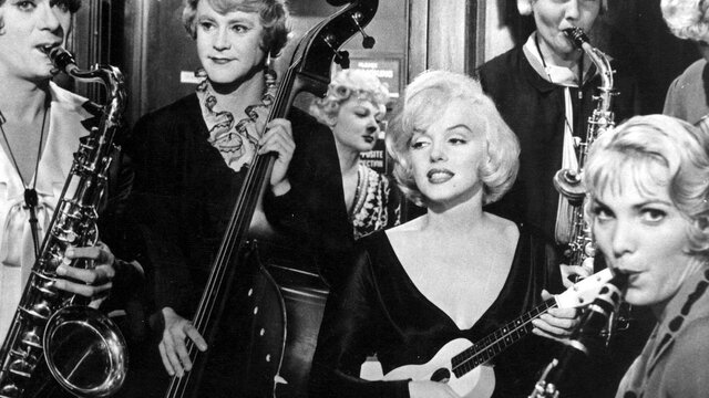 Some Like it Hot (1959) Black and white still of Marilyn Monroe surrounded by musicians