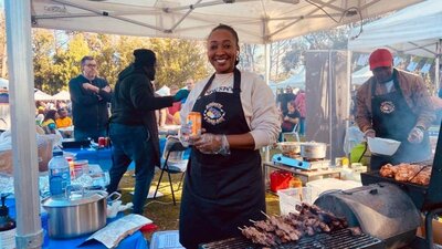 barbeque and woman smiling at African Festival in the Park