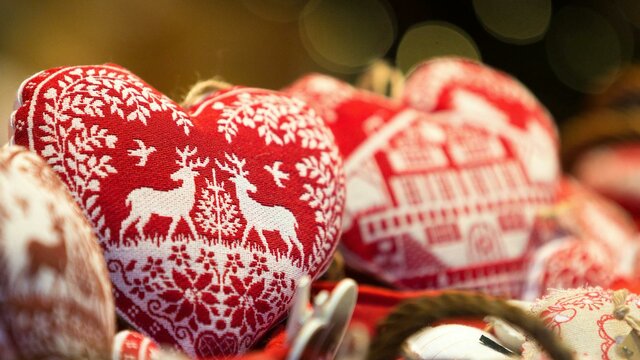 Heart shaped Christmas ornaments on display at a market