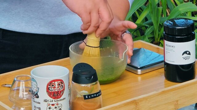 person making matcha person making matcha