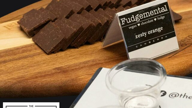 fudge on a wooden platter and tasting glasses of gin