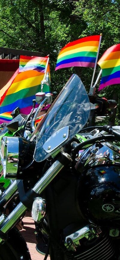 Motorbikes with rainbow flag decorations