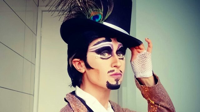 Guy Alias performing at SpringOUT Drag King with tophat