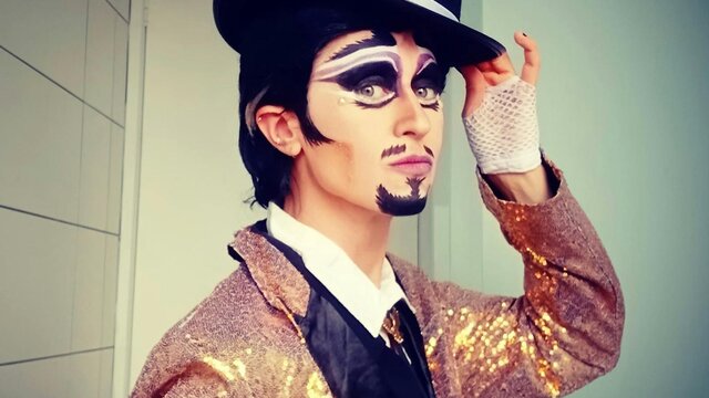 Guy Alias performing at SpringOUT Drag King with tophat