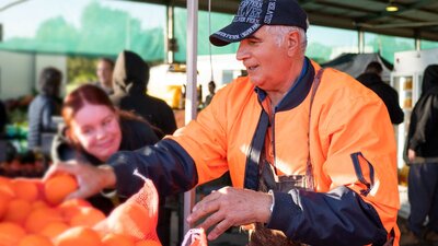 Citrus producer selling oranges at farmers market