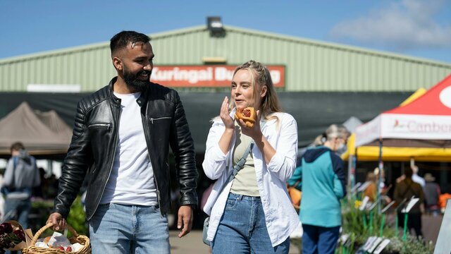 Shoppers enjoying the Capital Region Farmers Market shoppers enjoying food and shopping at the farmers market