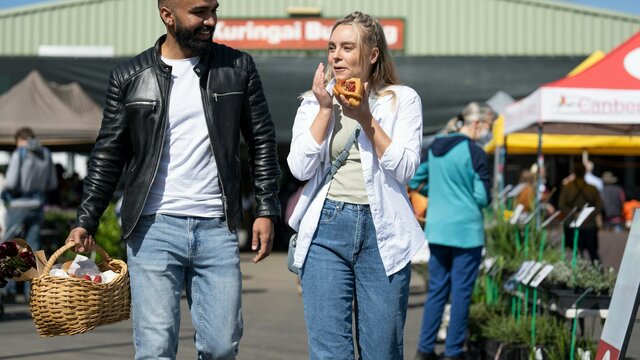 Shoppers enjoying the Capital Region Farmers Market shoppers enjoying food and shopping at the farmers market