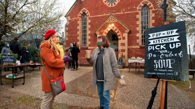 nla.obj-2931859327 People gathering outside a red brick church.