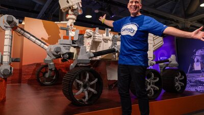 Ryan 'Brickman' McNaught with the Mars Rover Perseverence  made from LEGO® bricks
