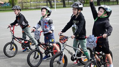 Four young boys with their bikes