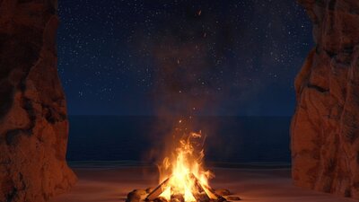 An image of a fire pit with a sandy background.