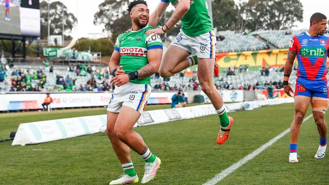 Canberra Raiders players Simi Sasagi and Jed Stuart celebrating a try.