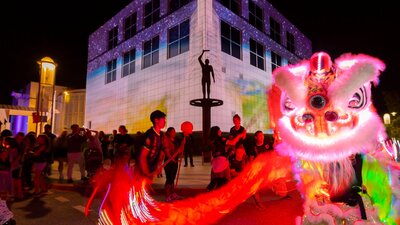 Questacon illuminated with Chines dragon dancers