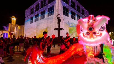 Questacon illuminated with Chines dragon dancers