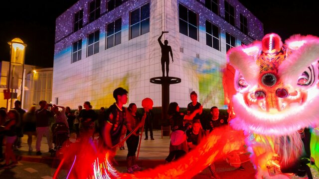 Questacon illuminated with Chines dragon dancers