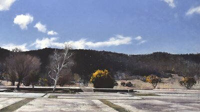 An image of a landscape painting featuring disused concrete slabs before a mountainous scene