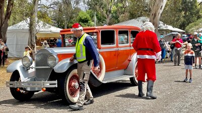 Santa and vintage classic car