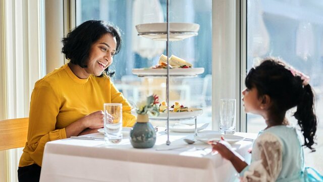 Mother and young daughter enjoying high tea at Parliament House