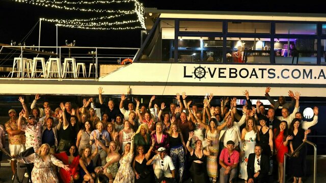 Love Boats, Canberra Large boat surrounded with people having fun
