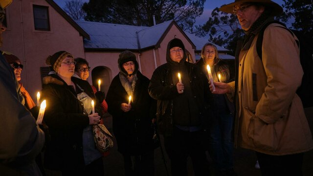 Tim the Yowie Man explaining something at Lanyon Homestead at dusk