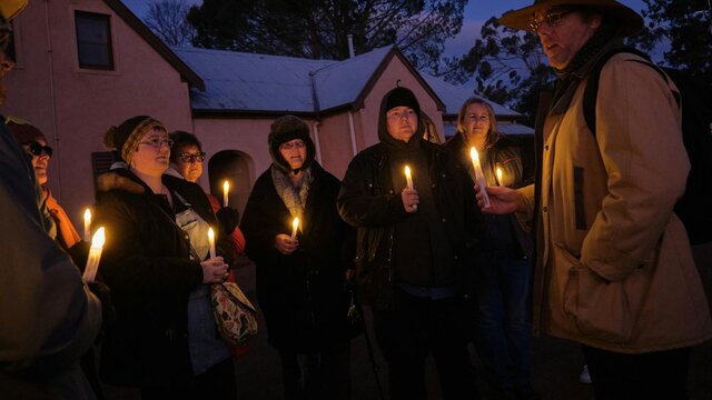 Tim the Yowie Man explaining something at Lanyon Homestead at dusk