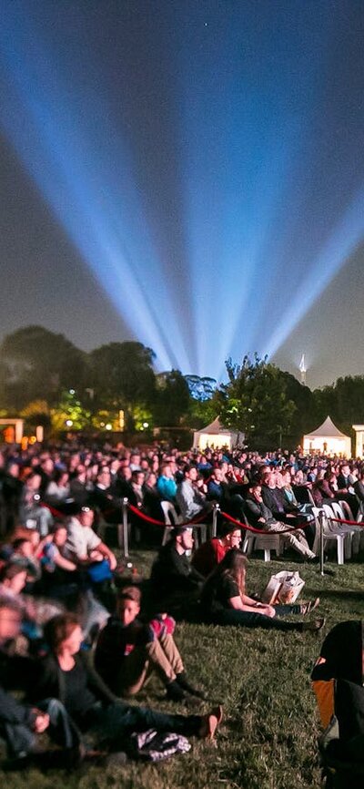 Crowd on lawns watching movies