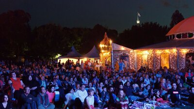 Outdoor audiences looking at the films