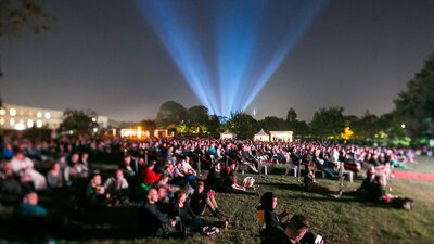 Crowd on lawns watching movies