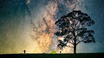 Astrophotographer under the Milky Way Core