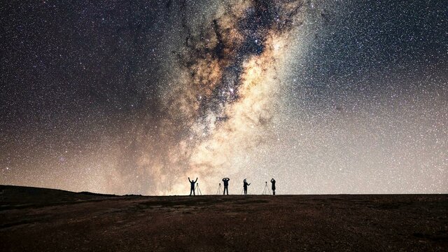 YMCA pose under the Milky Way Group photo under the stars
