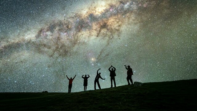 Photographers posing YMCA under the Milky Way Photographers under the milky way