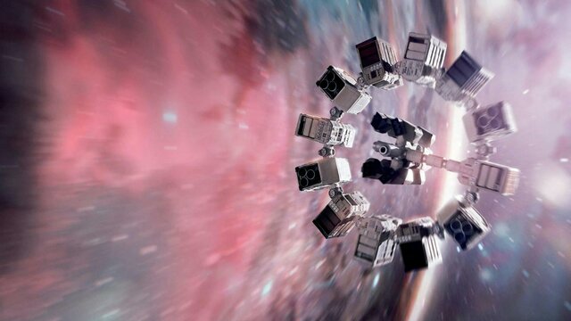 Winter Warmers: Movie Marathon: Christopher Nolan Spotlight Spaceship speeding through a multicoloured universe