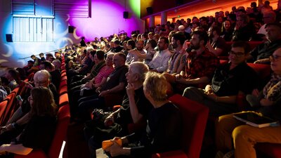 Don't Forget to Remember. November 2024. National Gallery of Australia. Kamberri/Canberra A photograph of a theatre audience sitting and talking.