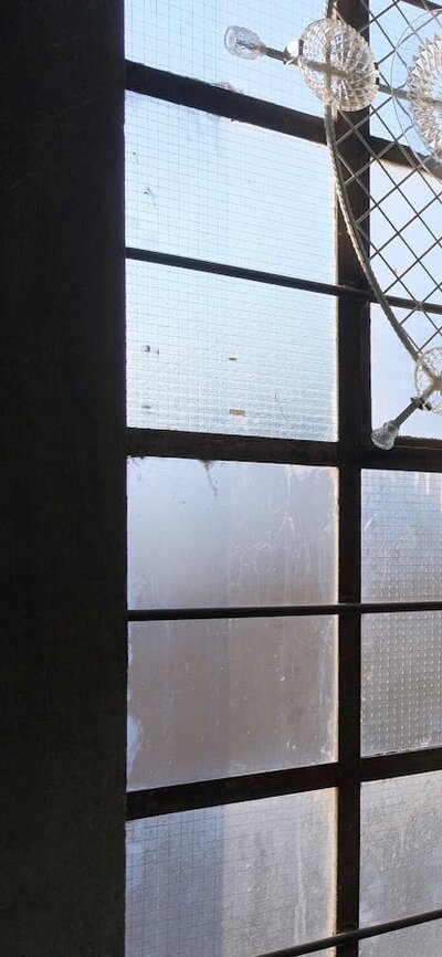 Designer standing in Glassworks heritage stairwell