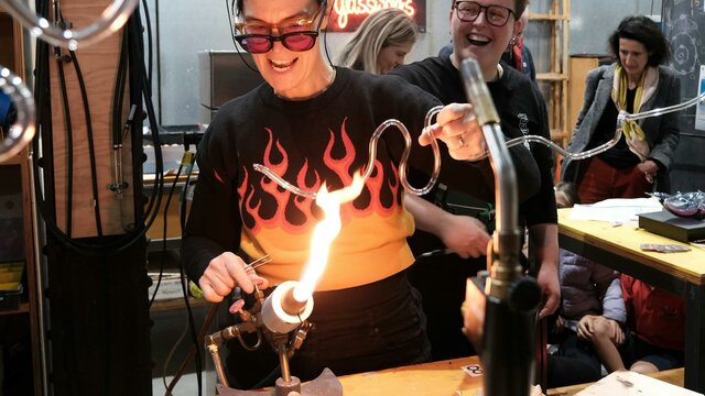 Artist Harriet Schwarzrock bending neon at Canberra Glassworks Neon bending at Canberra Glassworks