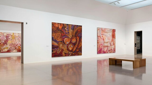 Installation view, Ngura Puḻka – Epic Country, National Gallery of Australia, Kamberri/Canberra, 202 Installation view of large and colourful first nation's works