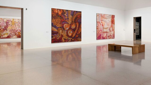Installation view, Ngura Puḻka – Epic Country, National Gallery of Australia, Kamberri/Canberra, 202 Installation view of large and colourful first nation's works