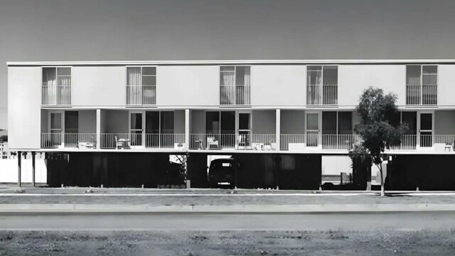 Heritage Series Maisonettes A black and white photo of the Northbourne Ave Flats in brutalist style from the road