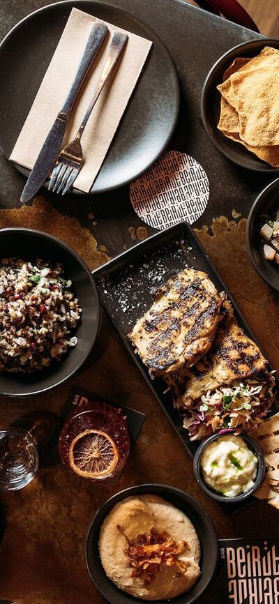 Collection of dishes available at Bar Beirut on a table