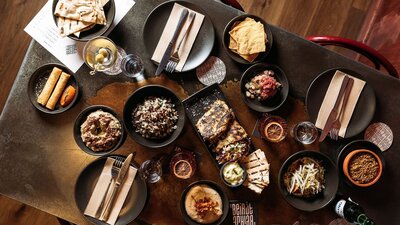 Collection of dishes available at Bar Beirut on a table