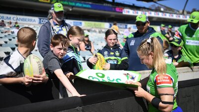 Sophie Holyman interacts with fans after the Raiders game against the Knights