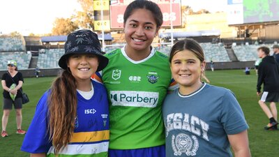 Monalisa Soliola takes a photos with fans on the field at GIO Stadium Canberra