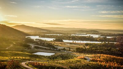 Looking over the National Arboretum and Lake Burley Griffin at sunset.