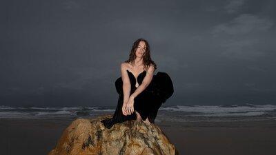 Meg Washington Meg Washington on a rock by the sea