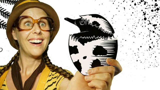 Spike the Echidna, Photo Jeremy Lavender Girl with glasses holding a shadow puppet echidna hatching out of an egg