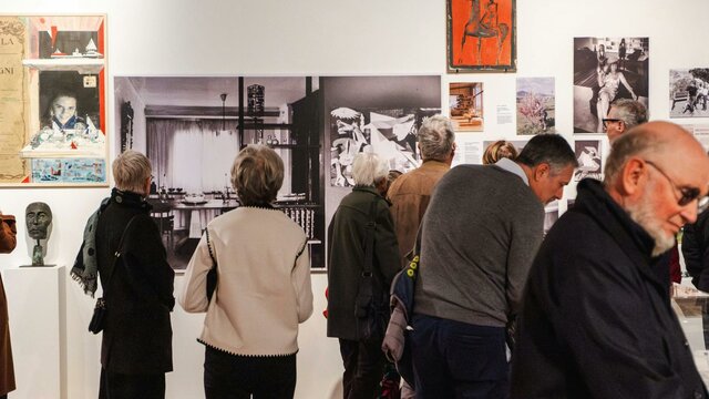 People exploring the Taglietti Exhibition