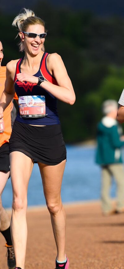 People running and smiling towards the camera